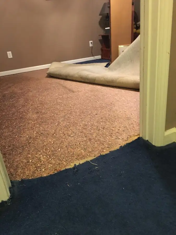 Carpet pad removal revealing water damage during Water Mitigation Services in Rincon Valley